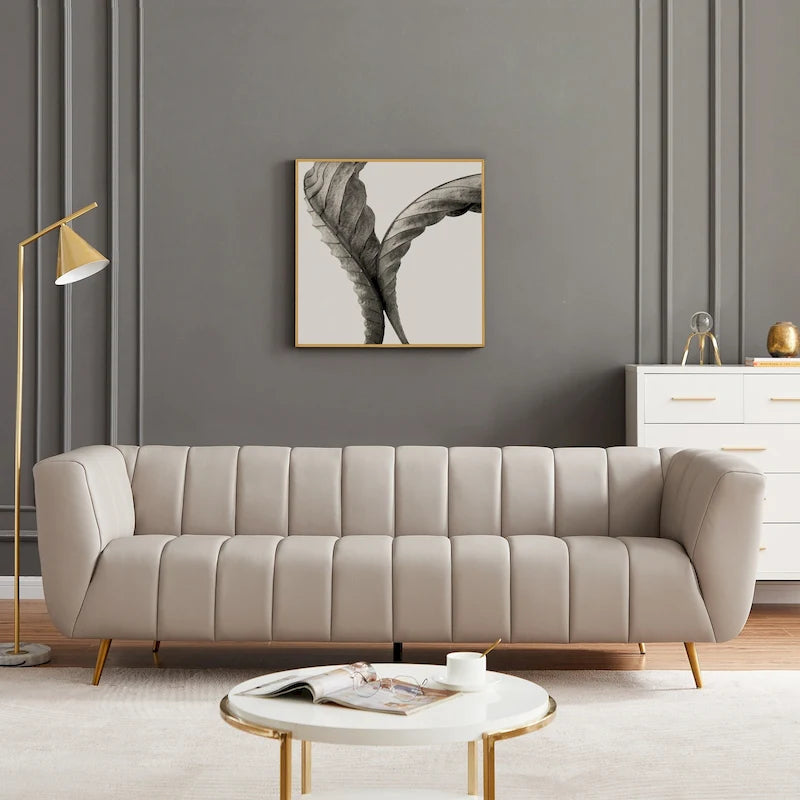 Szara trzyosobowa sofa skórzana pikowana w stylu połowy wieku