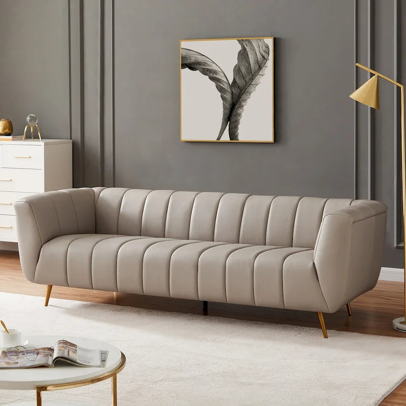 Szara trzyosobowa sofa skórzana pikowana w stylu połowy wieku